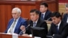 Prime Minister Sooronbai Jeenbekov (center) speaks during a parliament session on November 8.