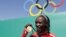 Kenyan gold-medalist Jemima Jelagat Sumgong poses after the podium ceremony for the women's marathon at the Rio 2016 Olympic Games at Sambodromo in Rio de Janeiro on August 14.
