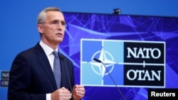 NATO Secretary General Stoltenberg talks to reporters in Brussels on January 12