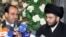 Iraqi Prime Minister Nuri al-Maliki (left) and Shi'ite cleric Muqtada al-Sadr (file photo)