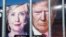 Images of Democratic nominee Hillary Clinton (left) and Republican nominee Donald Trump are seen behind a security fence where they debated in New York.