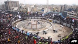 The monument was still under construction in this photo of a pro-government rally at Revolution Square in December 2009.