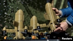 A Sting interceptor drone by the Ukrainian company Wild Hornets is displayed at an undisclosed location in Ukraine in March. 
