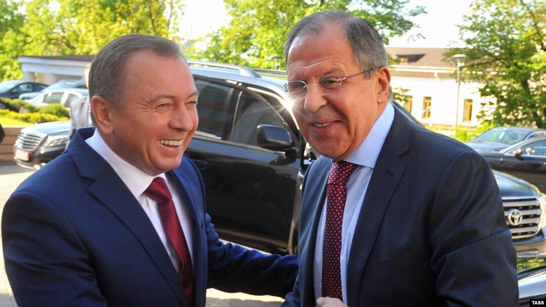 Belarusian Foreign Minister Vladimir Makey (left) and Russian Foreign Minister Sergei Lavrov shake hands as they meet for talks in Minsk on May 16.