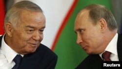 Russian President Vladimir Putin (right) and his Uzbek counterpart Islam Karimov at the Kremlin in Moscow on April 15. 