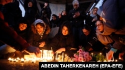 Iranians light candles for victims of Ukraine International Airlines Boeing 737-800 as they protest in front of Amir Kabir University in Tehran, Iran, 11 January 2020. 