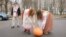 Women in national garb roll out a pumpkin in front of the Russian Embassy in Minsk on December 5 in a protest over possible deepening integration. In local custom, when a woman presents a man with a pumpkin, she's telling him he's undesirable.