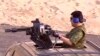 Turkmenistan -- Turkmen president Berdymukhammedov using machine gun