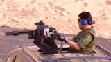 Turkmenistan -- Turkmen president Berdymukhammedov using machine gun