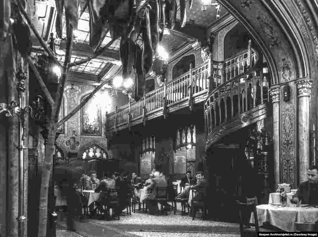 The interior of Bucharest&rsquo;s Caru cu bere (The Beer Wagon) photographed in 1965. Uj Elet, meaning &quot;New Life&quot; was a Hungarian-language publication targeted at the approximately 1 million Hungarian speakers in Romania. The magazine began publication in 1959.