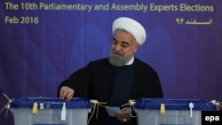 Iranian President Hassan Rohani casts his votes in Tehran.