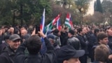 Protesters rally outside the parliament building in the capital of Georgia's breakaway region of Abkhazia