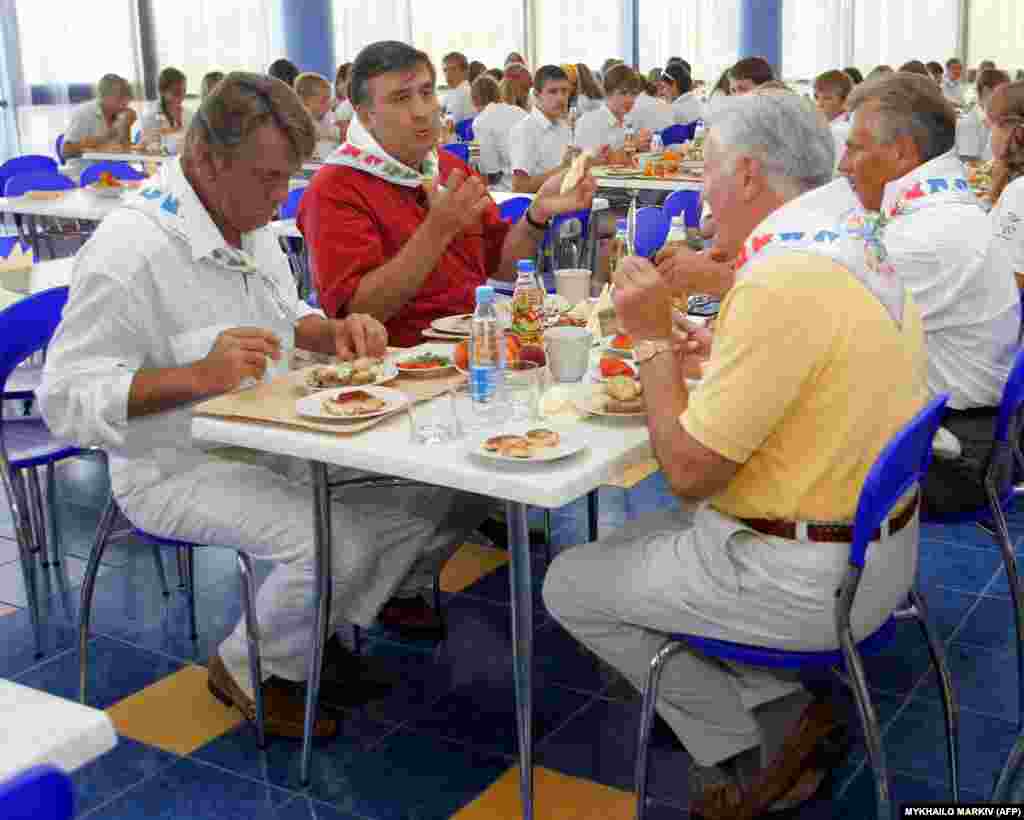 An August 2005 photo shows, left to right, Ukrainian President Viktor Yushchenko, Georgian President Mikhail Saakashvili, Lithuanian President Valdis Adamkus, and Polish President Aleksander Kwasniewski sharing a meal at Artek.Following the collapse of the Soviet Union, the camp was inherited by a newly independent Ukraine. But amid the economic turmoil of the 1990s, the site soon fell into disrepair and was later embroiled in scandal over alleged sexual abuse.