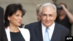 Dominique Strauss-Kahn and his wife, Anne Sinclair, leave the New York State Supreme Court in New York on July 1.