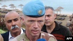 Syria -- The head of the UN observer mission in Syria, Major General Robert Mood, talks to local state-run television stations during a visit to the coastal city of Latakia in early May.