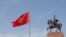 A Kyrgyz flag flies at half-staff in Bishkek in honor of 14 Kyrgyz migrant workers who died in a fire in Moscow on August 27. 