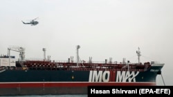 Iran's Revolutionary Guard chopper hovers around the detained British-flagged tanker Stena Impero in Bandar Abbas, July 21, 2019 