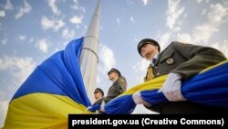 Ukrainian soldiers take part in National Flag Day celebrations in Kyiv on August 23. 