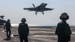 A F/A-18F Super Hornet fighter jet lands on the USS Abraham Lincoln in the Arabian Sea late last month. 