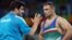 کمیل قاسمی در حال گفت‌وگو با رسول خادم در جریان رقابت‌های المپیک ۲۰۱۶ در ریو/ او در این رقابت‌ها نشان نقره را از آن خود کرد.