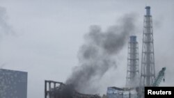 Апаттан кейін түтіндеп жатқан "Фукусима-Дайичи" АЭС-і. Жапония, 21 наурыз 2011 жыл.