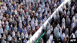 Iranian Muslims perform the Eid al-Fitr prayers at the Abdul Azim shrine in southern Tehran in June 2019.