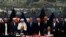 While the chief executive of the Afghan government Abdullah Abdullah (fourth from left) and President Ashraf Ghani (fourth from right) look on, Afghan National security adviser Hanif Atmar (at table,right) and U.S. Ambassador James Cunningham sign a bilateral security agreement in Kabul on September 30.