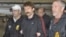 Convicted Russian arms dealer Viktor Bout (center) is escorted by U.S. Drug Enforcement Administration officers after arriving in the United States following his extradition from Thailand last year. 