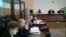 Первая попытка провести судебный процесс началась в марте и закончилась через четыре месяца, когда 9 июля председательствующий на процессе судья подал в отставку в связи с истечением срока полномочий