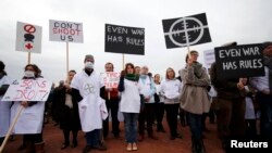 The staff of Medecins Sans Frontieres (MSF), also known as Doctors Without Borders, demonstrates in Geneva on November 3.