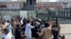 Police Clash With Protesters In Pakistan's Peshawar