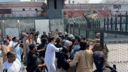 Police Clash With Protesters In Pakistan's Peshawar