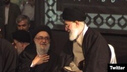 Ayatollah Seyyed Mohammad Mousavi-Khoiniha with Supreme Leader Ali Khamenei. Undated photo. 