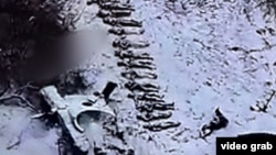 In this drone image provided by Ukrainian authorities, bodies of soldiers can be seen lined up in Russia's Kursk region in December 2024. North Korean troops are reportedly among them.
