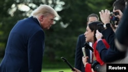 US President Donald Trump takes questions from reporters at the White House in Washington on October 12, 2026.