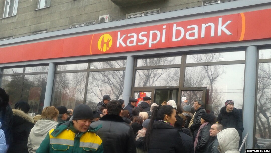 Clients of Kazakhstan's Kaspi Bank queue to withdraw deposits on February 19. 
