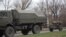 A truck tows a 122-millimeter artillery piece on a main road east of Donetsk on November 11.