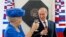 Dutch Queen Beatrix and Russian President Vladimir Putin raise their glasses after they unveiled a plaque during their visit to the Hermitage Museum in Amsterdam on April 8.