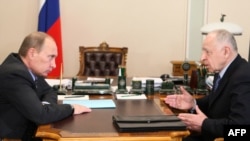 Daghestan's President Mukhu Aliyev (right) meets with Russian Prime Minister Vladimir Putin in March.