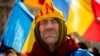 A supporter of banned candidate Calin Georgescu attends a protest in Bucharest in February.