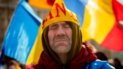A supporter of banned candidate Calin Georgescu at a protest in Bucharest in February 2025.