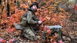 An artilleryman of the Special Rifle Police Battalion of Zaporizhzhya region sets up a Starlink satellite Internet system at a position near the front line in the Donetsk region on October 16.