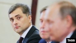 Analysts say moving Vladislav Surkov (left) out of the Ukraine picture could pave the way both for improved relations with the West and bolstering Moscow's sway in Kyiv.