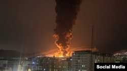 Blasts shake an oil depot near Tehran on March 7 following an Israeli air strike.