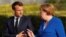 German Chancellor Angela Merkel (right) and French President Emmanuel Macron are the most confidence-inspiring world leaders according to a new global survey. 