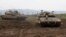 Israeli army Merkava tanks gather in the Israeli-annexed Golan Heights, on January 20, 2019. 