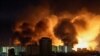 An explosion lights up the sky over Kyiv during a Russian drone strike.