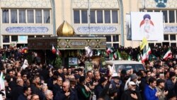 People attend the funeral of IRGC spokesman Ali Mohammad Naini after Eid al-Fitr prayers in Tehran on March 21.
