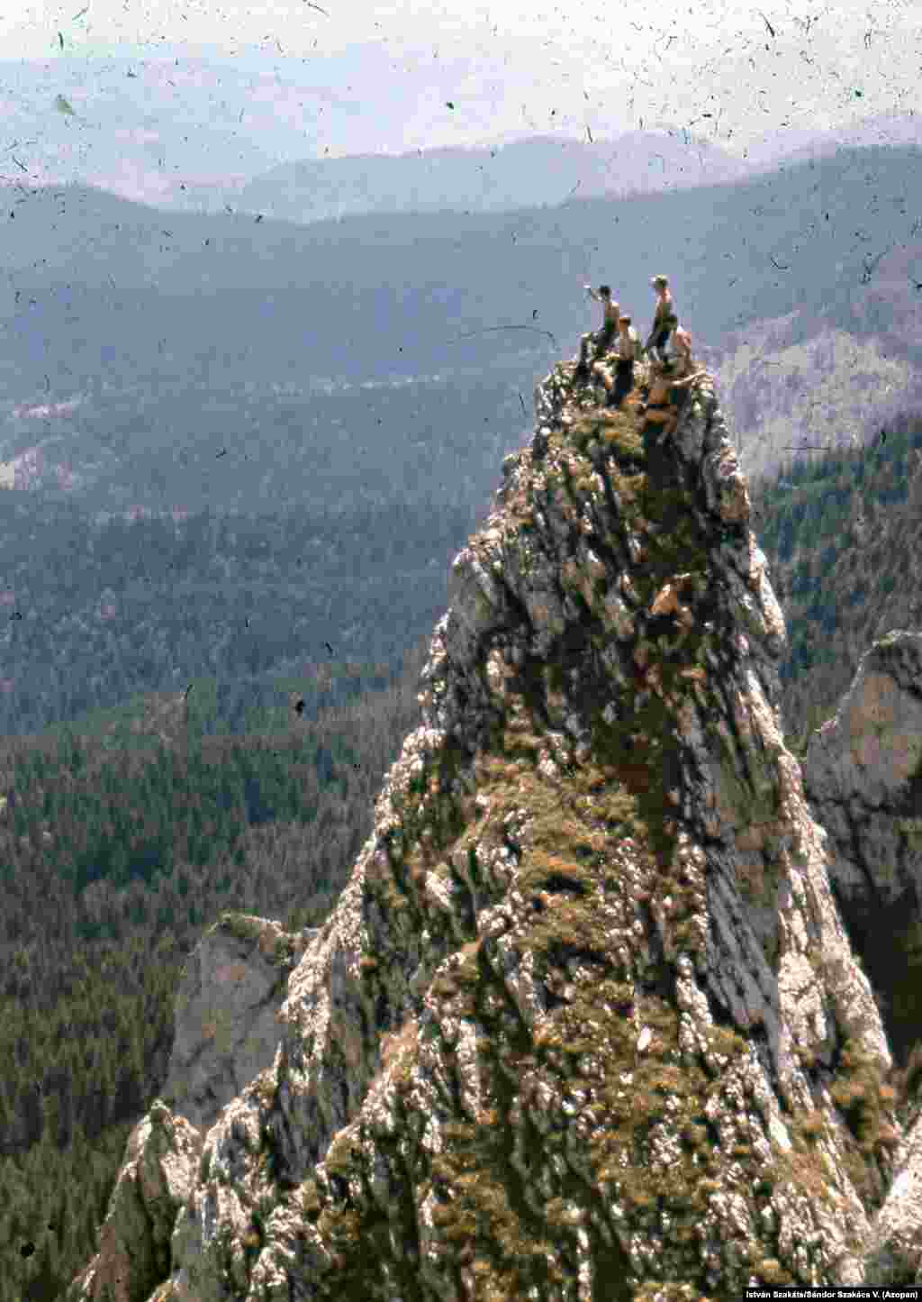 Men clamber a sharp peak in the Hasmasul Mare mountains in 1951. &nbsp; &nbsp; &nbsp; &nbsp;