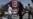People walk past a billboard with an image of Iran's late Supreme Leader Ayatollah Ali Khamenei in Tehran on July 13. 